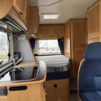 Hymer B574 – Ruime integraalcamper met vast bed én riant hefbed Foto #1